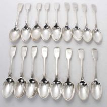 Thirteen Victorian silver Fiddle pattern dessert spoons, twelve with engraved initials