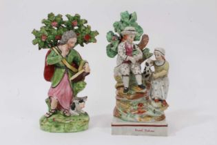 Two early 19th century Staffordshire pearlware figures, including one showing a couple seated on a g