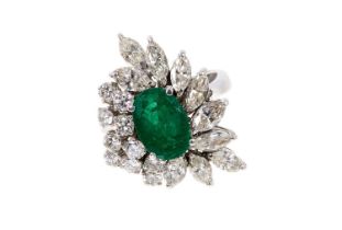 Emerald and diamond cocktail ring, the asymmetrical cluster with a central oval mixed cut emerald an