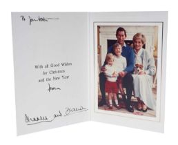 T.R.H. The Prince and Princess of Wales, signed 1986 Christmas card, with twin gilt ciphers to cover