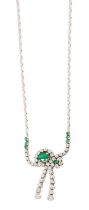 Emerald and diamond necklace with a crossover design of graduated brilliant cut diamonds in 18ct whi