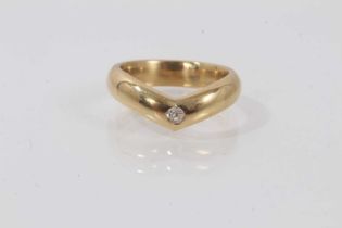 18ct gold wishbone ring set with a small old cut diamond, ring size P.