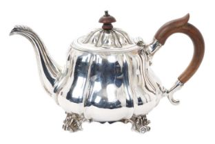 George IV silver tea pot of compressed baluster form