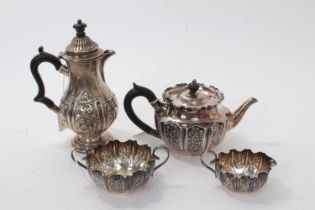 Victorian silver batchelors' three piece tea set with repoussé floral scroll decoration ( Sheffield