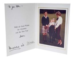 T.R.H. The Prince and Princess of Wales, signed 1985 Christmas card, with twin gilt ciphers to cover