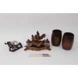 Black Forest desk stand, pair of treen baluster cups, Victorian novelty inkwell