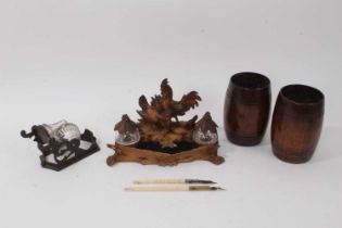 Black Forest desk stand, pair of treen baluster cups, Victorian novelty inkwell