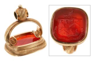 Large good quality 19th century yellow metal seal, the carnelian with intaglio engraved family crest
