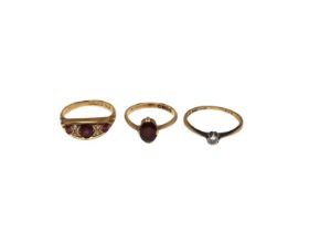 18ct gold diamond single stone ring, 18ct gold garnet single stone ring and 18ct gold ruby and diamo