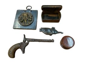 Group of vertu items, including snuff boxes, an Eastern brass plaque, toy gun
