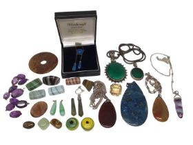 Semi-precious stone pendants, some on chains and other loose gem stones