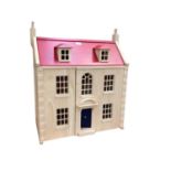 Contemporary children's dolls house together with a contemporary miniature pine dresser and two ches