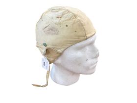 Vintage leather flying helmet on mannequin head