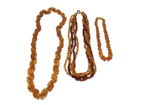 Amber bead torsade necklace with silver clasp, 48.5cm long and two other reconstituted amber bead ne