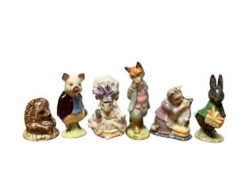 Eleven Beswick Beatrix Potter figures and a Beswick stand