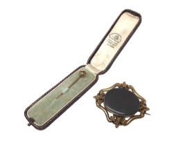 Victorian 15ct gold seed pearl stick pin and Victorian gilt metal brooch with glazed locket compartm