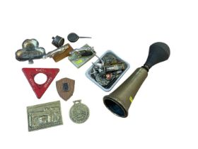 Early 20th century brass car horn, together with two Jaguar mascots, and group of other motoring rel