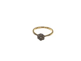 18ct gold diamond flower head ring in platinum setting