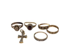 Four 9ct gold gem set rings, a diamond single stone ring and a diamond set cross pendant