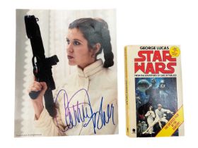 Star Wars interest: autographed photo of Carrie Fisher as Princess Leia, and a Star Wars novel with