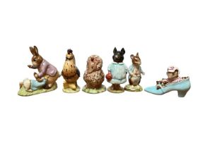 Eleven Beswick Beatrix Potter figures and a Beswick stand