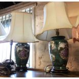 A pair of modern ceramic table lamps of vase form decorated in the Chinese manner