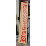 A painted wooden sign for Hashers Coffee House