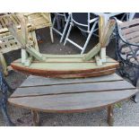 Three curved wooden garden benches