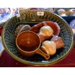 A large craft pottery bowl with impressed frieze decoration - sold with a small quantity of