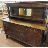 A 1.83m late Victorian stained carved oak mirror back sideboard with flanking bulbous supports and