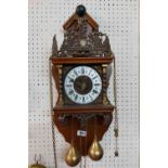 A 20th Century Zandaam mahogany and brass mounted wall clock with Hercules figure to top of bell and