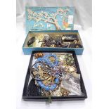 Two small boxes containing a collection of assorted costume jewellery