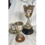 Three assorted silver plated trophy cups including two with socle bases
