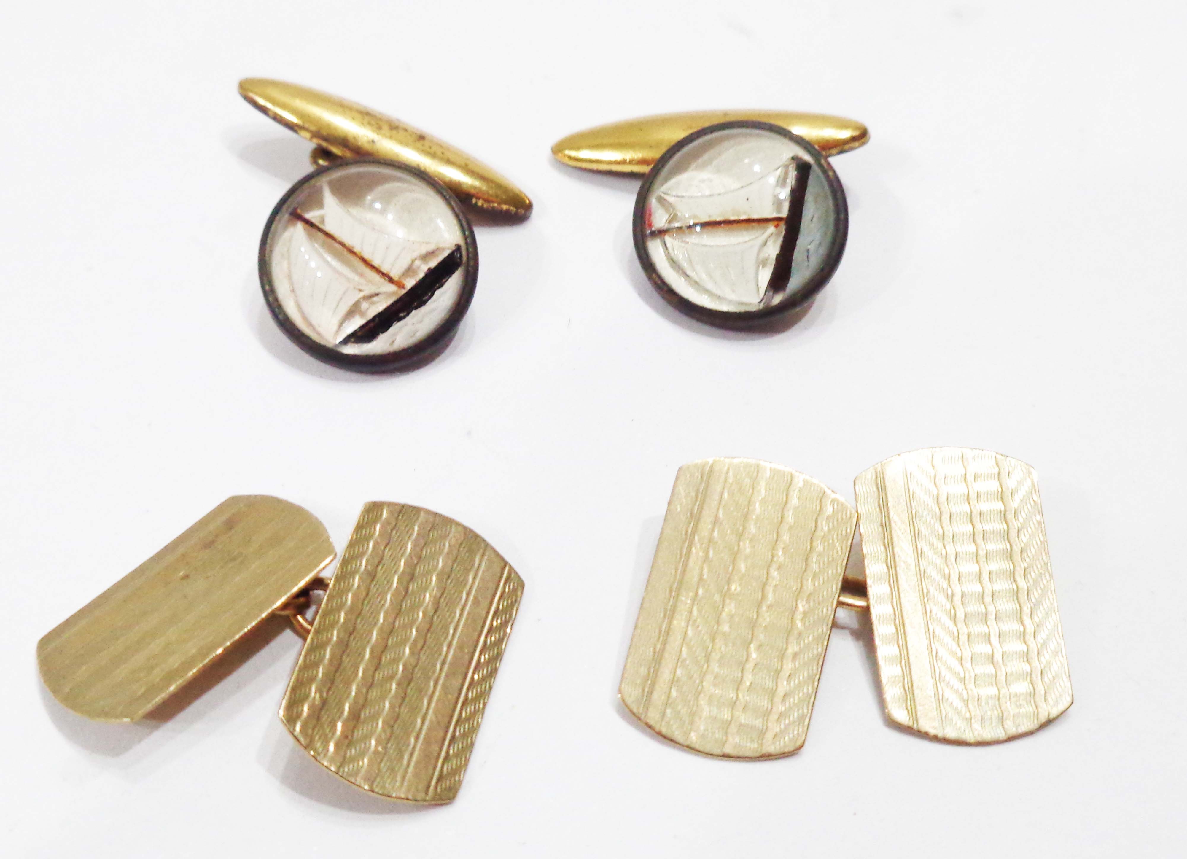 A pair of 9ct. gold panel cufflinks - sold with a pair of Essex crystal cufflinks with sailing