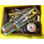 A crate and a drawer containing assorted silver plated and other cutlery, place markers, etc.