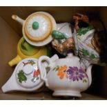 A box containing a quantity of tea and coffee pots