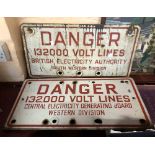 Two vintage electricity warning danger signs with red lettering on white ground