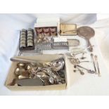 A box containing silver plated items including twelve matching napkin rings (initialled), ladle,