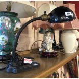 An early 20th Century American desk lamp with cast iron base, brass swan neck and painted metal