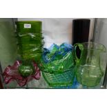 A quantity of coloured glassware including large green clear ribbon trailed vase, cranberry glass