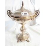 A 19th Century Elkington silver plated chalice with ornate cast and engraved decoration, flanking