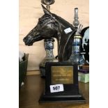 A cast resin horse racing presentation trophy depicting a horse's head with bronze effect finish,