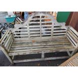 A teak Lutyens style three seater garden bench