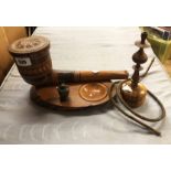 A carved wood smoker's companion in the form of a pipe - sold with a turned wood hookah pipe