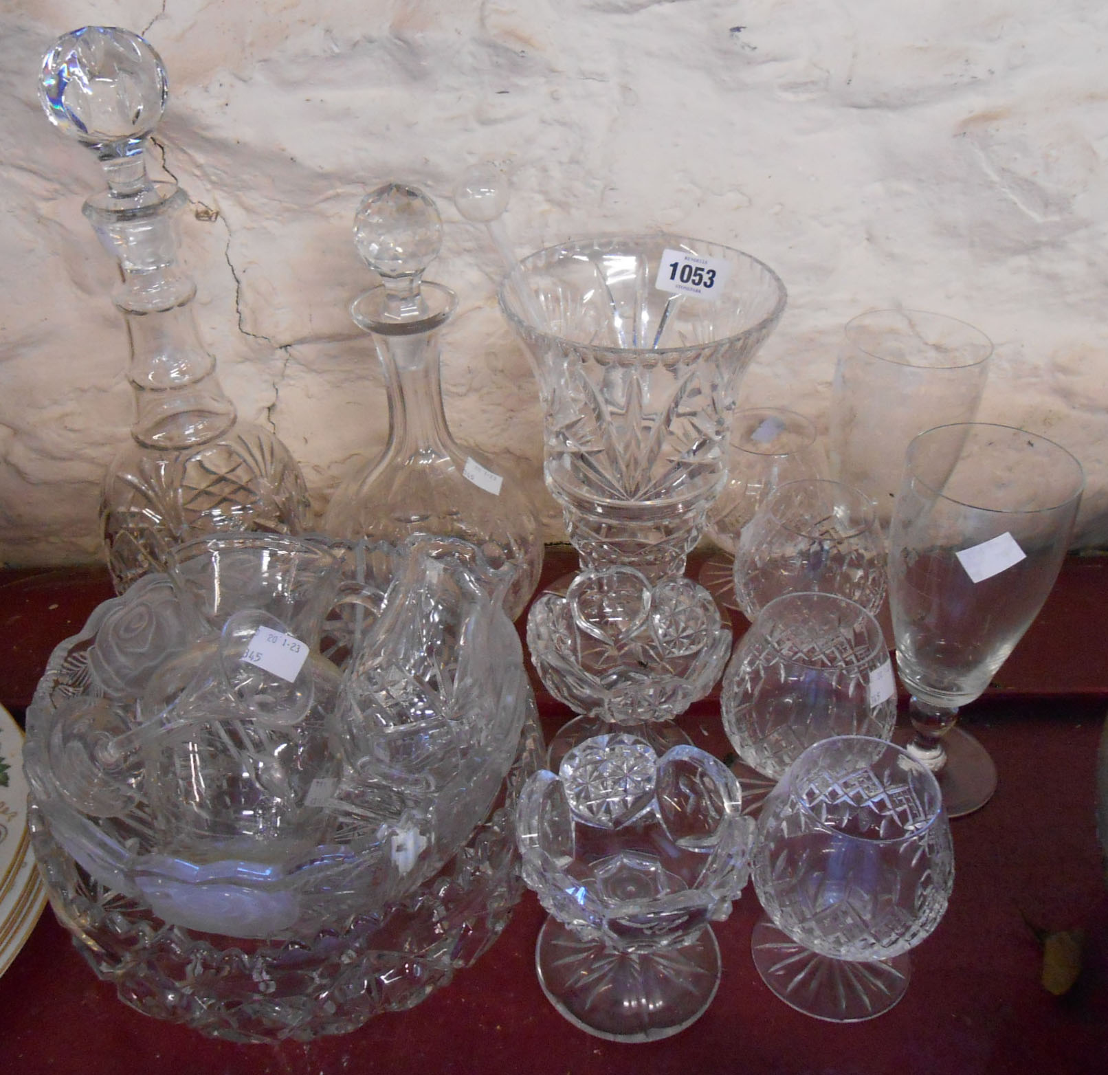 A quantity of assorted cut and other glassware including vases, decanters, bowls, etc.