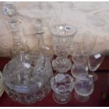 A quantity of assorted cut and other glassware including vases, decanters, bowls, etc.