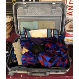 A suitcase containing a quantity of Masonic related items including regalia, books, etc.