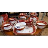 A Royal Worcester part tea set decorated with hand painted floral sprays with burgundy and gilt