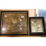 An antique embroidered silk panel depicting a large floral spray set in gilt gesso frame - sold with