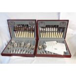 Two vintage stained wood canteens containing a quantity of assorted silver plated cutlery